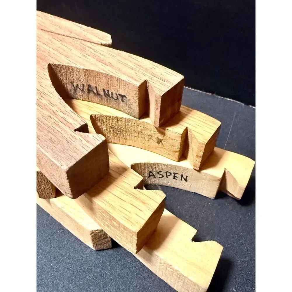 Wooden Stacking Dudes interlocking human shaped made of multiple woods